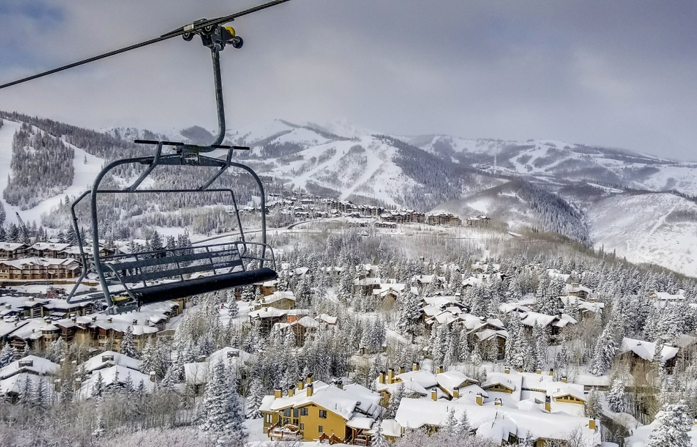 An aerial photo of Deer Valley covered in snow from the viewpoint of a ski lift chair